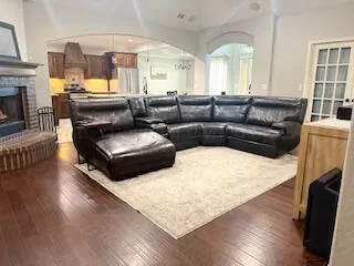 a living room with furniture and a fireplace
