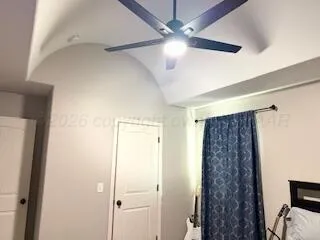 a bathroom with a shower and a mirror