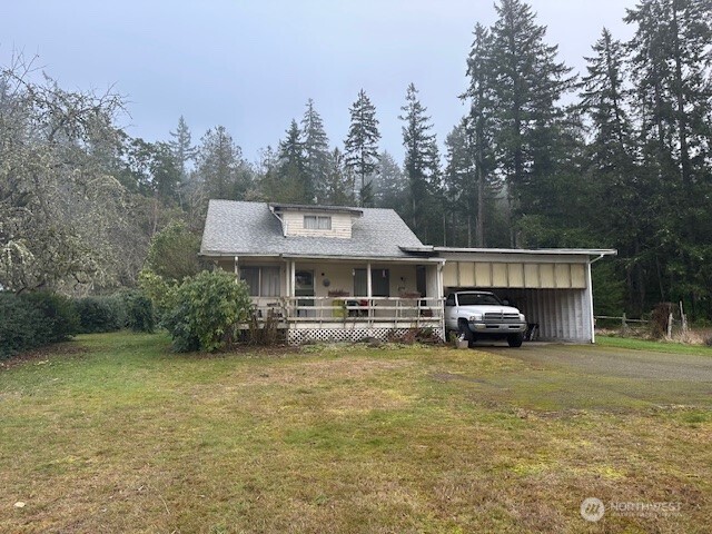 3503 Northwest Mountain View Road Silverdale, WA 98383 - Photo 2 of 7 a view of a house with garden and trees