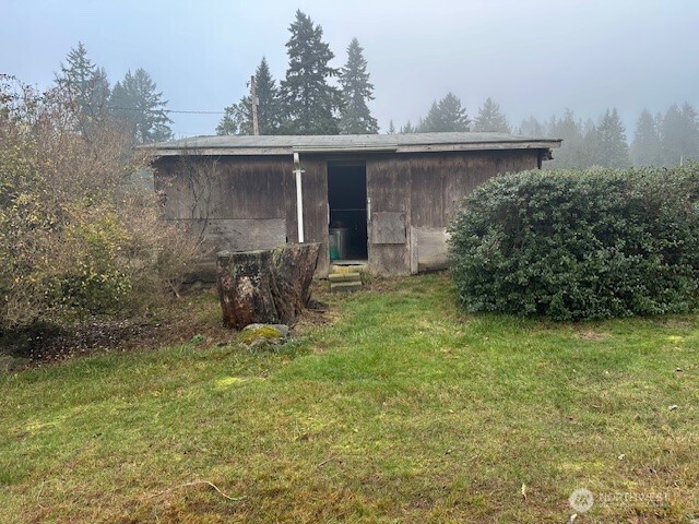 3503 Northwest Mountain View Road Silverdale, WA 98383 - Photo 7 of 7 a view of a house with backyard and sitting area