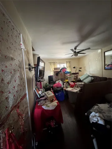 a living room with lots of furniture and a wooden floor