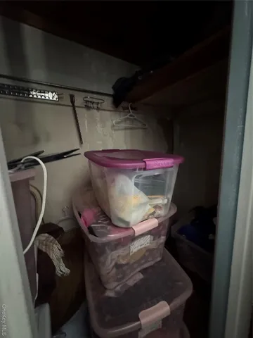 a bedroom with a bed and a mirror