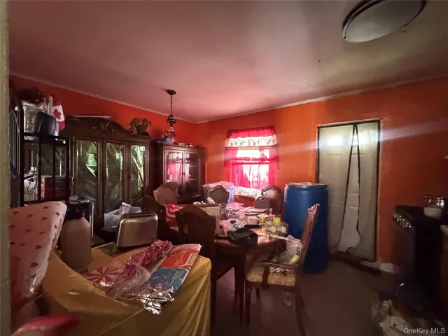 a living room with furniture a lamp and a chandelier