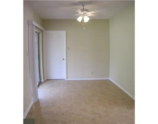 a view of a chandelier fan in a room