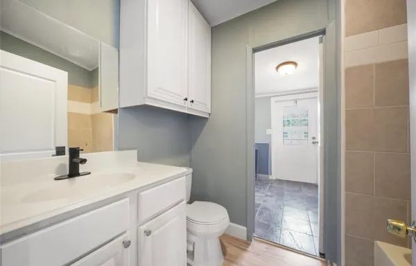 a bathroom with a sink toilet and shower