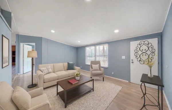 a living room with furniture and a window