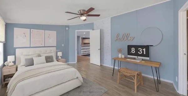 a bedroom with a bed and a table in it