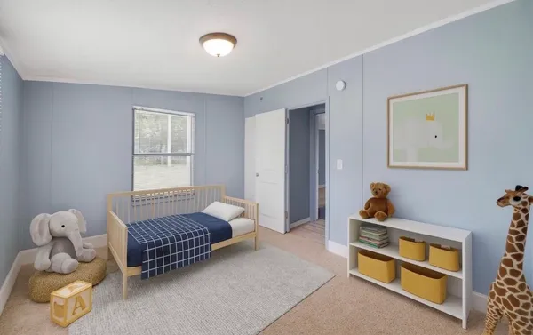 a bedroom with bed and a window