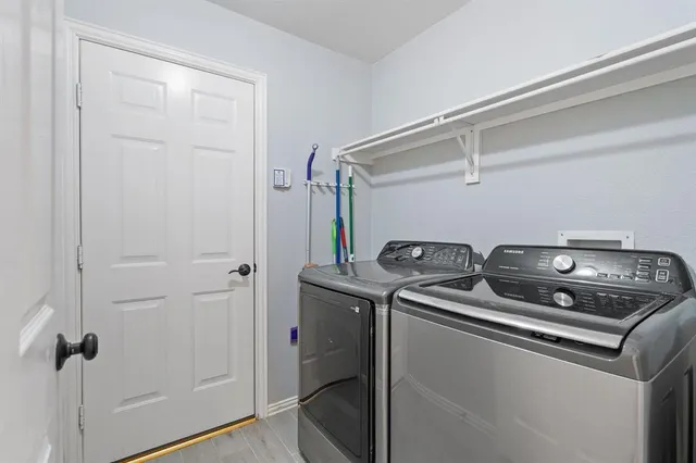 a utility room with dryer and washer