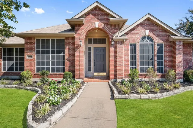 front view of a house with a yard