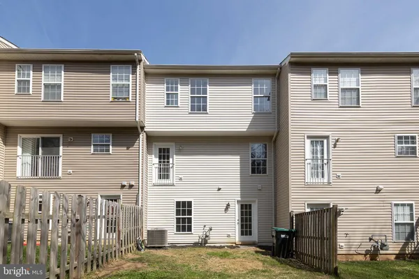 a brick house with a large windows
