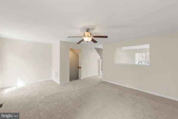 a view of a chandelier fan in a room