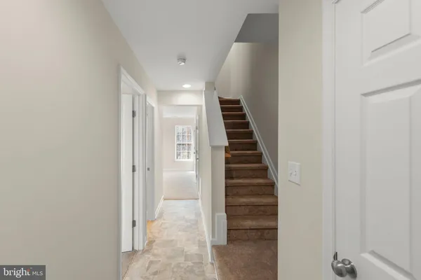 a view of a hallway with stairs
