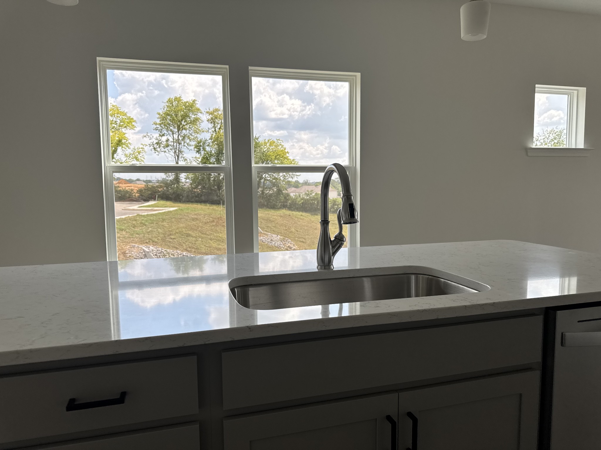 1120 June Wilde Ridge Spring Hill, TN 37174 - Photo 9 of 15 a view of kitchen sink a counter space and living room