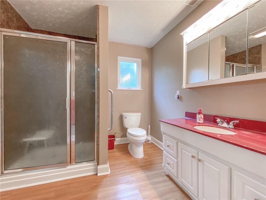 2022 Ridge Rd Extension Ambridge, PA 15003 - Photo 15 of 22 a bathroom with a sink and a mirror