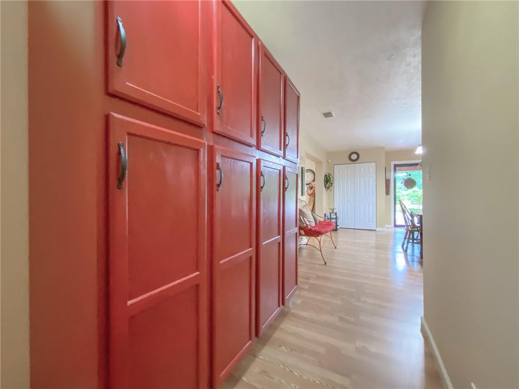 2022 Ridge Rd Extension Ambridge, PA 15003 - Photo 7 of 22 a view of a hallway with wooden floor and staircase