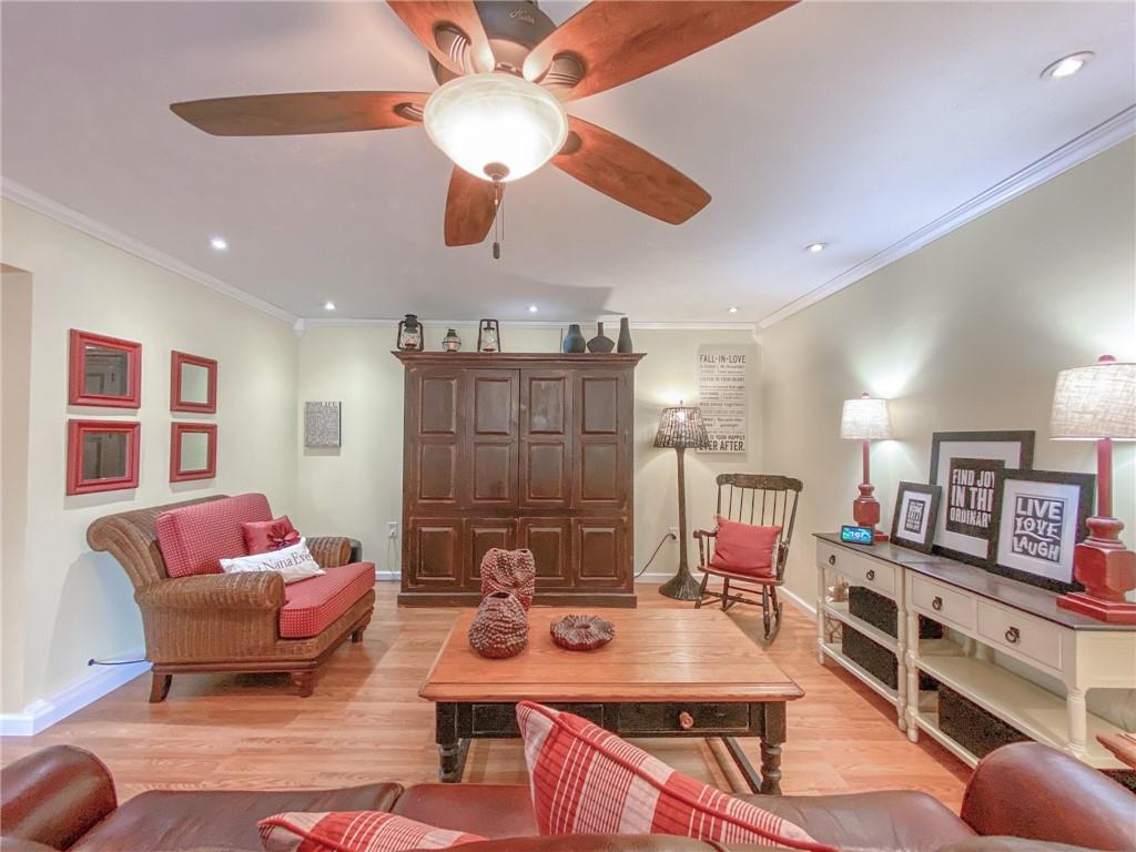 2022 Ridge Rd Extension Ambridge, PA 15003 - Photo 8 of 22 a living room with furniture a flat screen tv and a ceiling fan