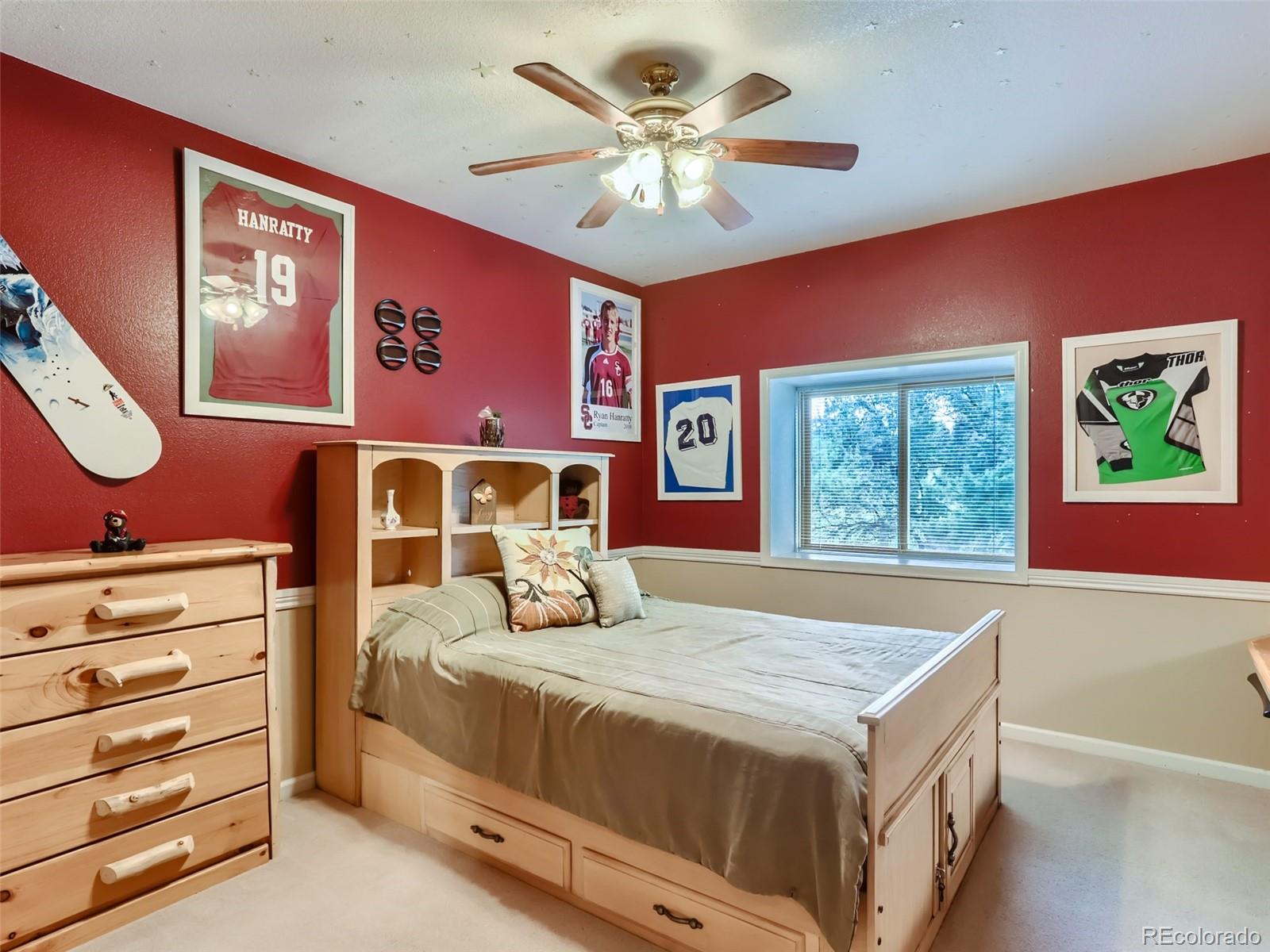 6370 Eagle Court Longmont, CO 80503 - Photo 17 of 39 a bedroom with a bed and a dresser