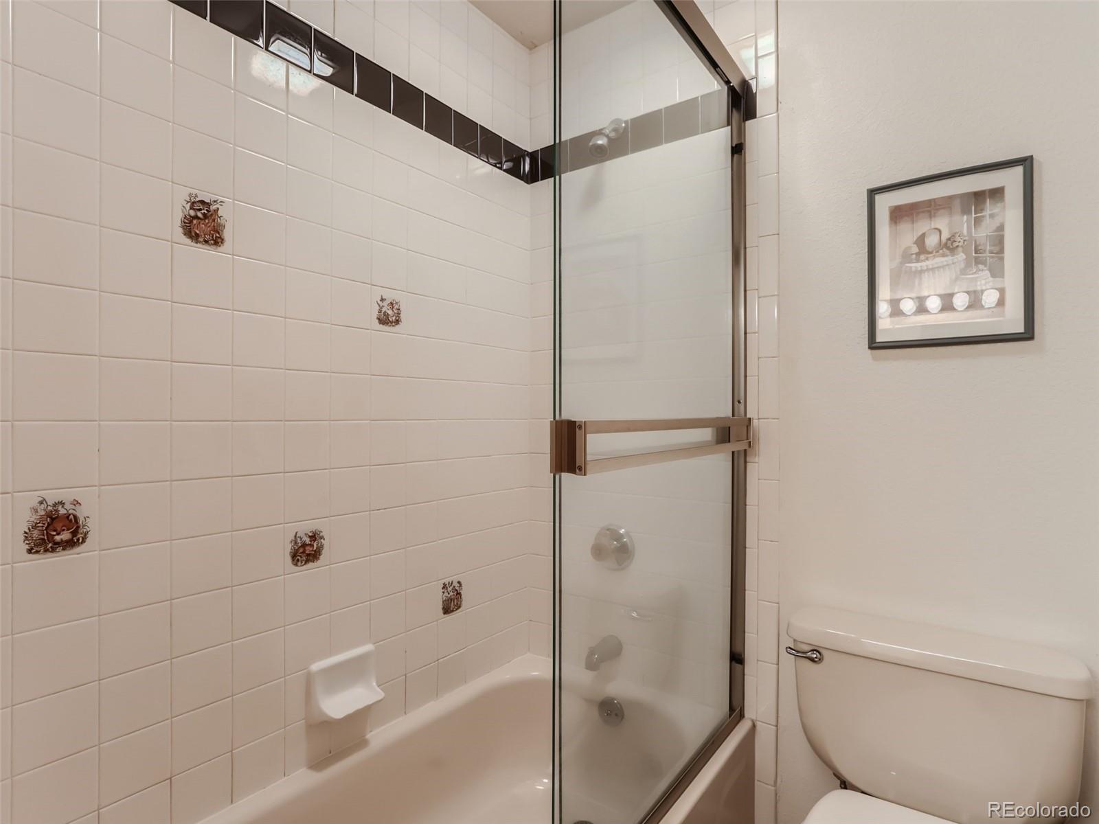 6370 Eagle Court Longmont, CO 80503 - Photo 21 of 39 a bathroom with a shower and a toilet