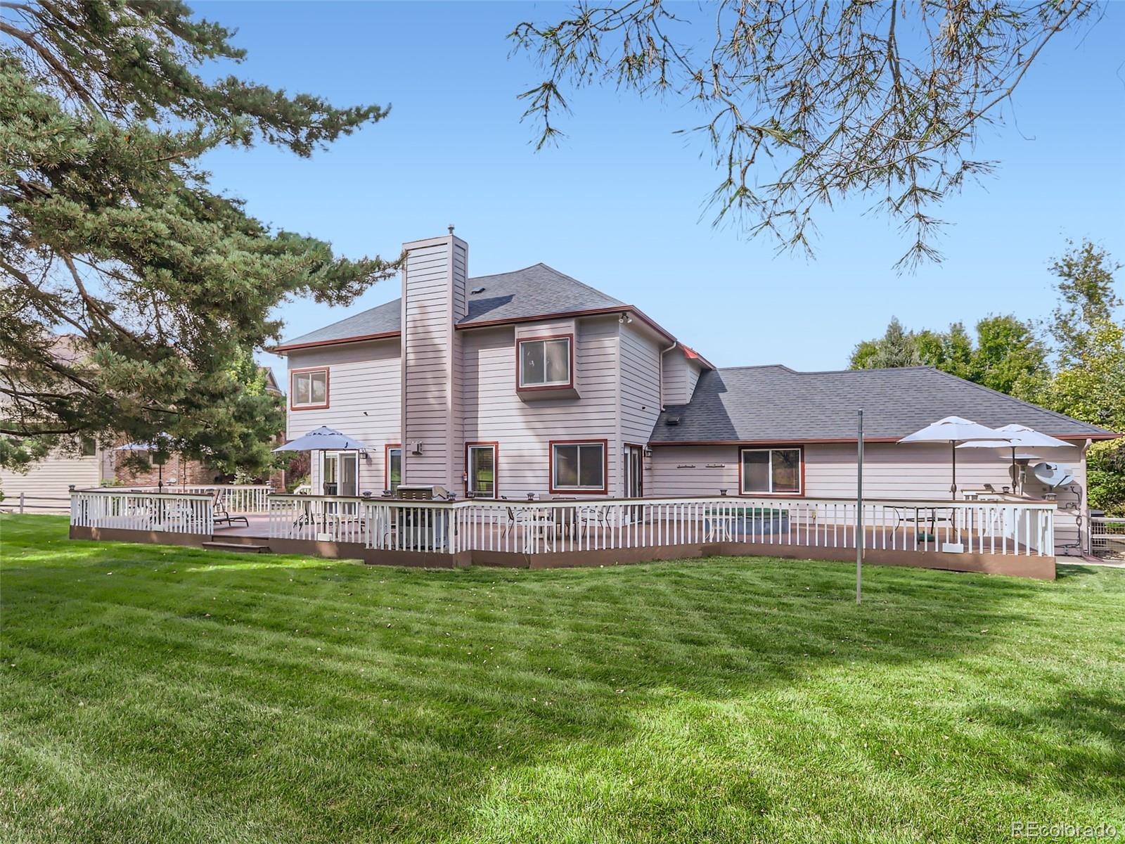 6370 Eagle Court Longmont, CO 80503 - Photo 29 of 39 a view of a house with a big yard and sitting area