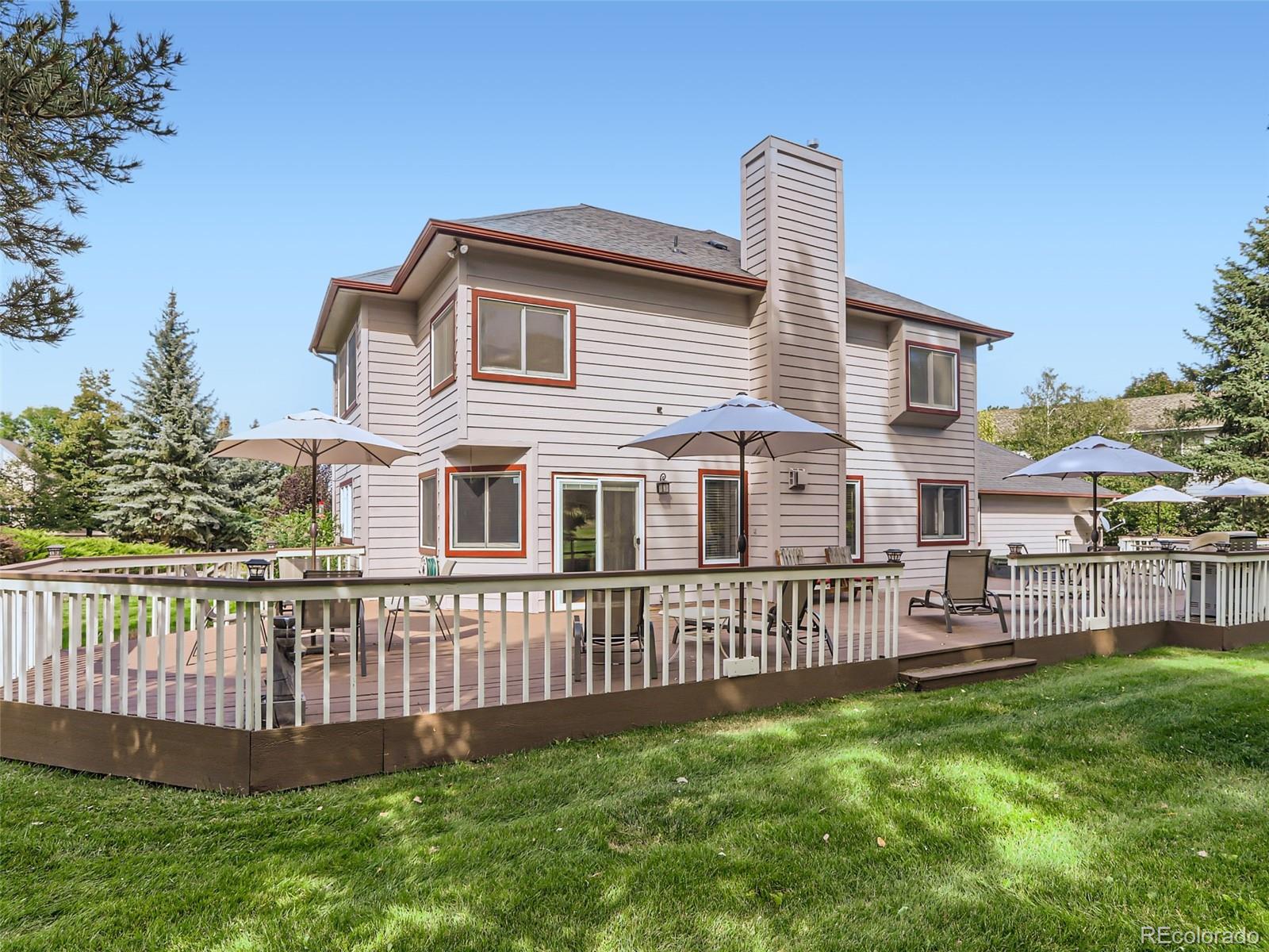 6370 Eagle Court Longmont, CO 80503 - Photo 30 of 39 a front view of a house with garden and deck