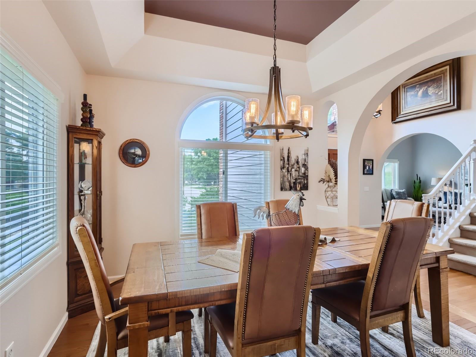6370 Eagle Court Longmont, CO 80503 - Photo 7 of 39 a view of a dining room with furniture window and wooden floor