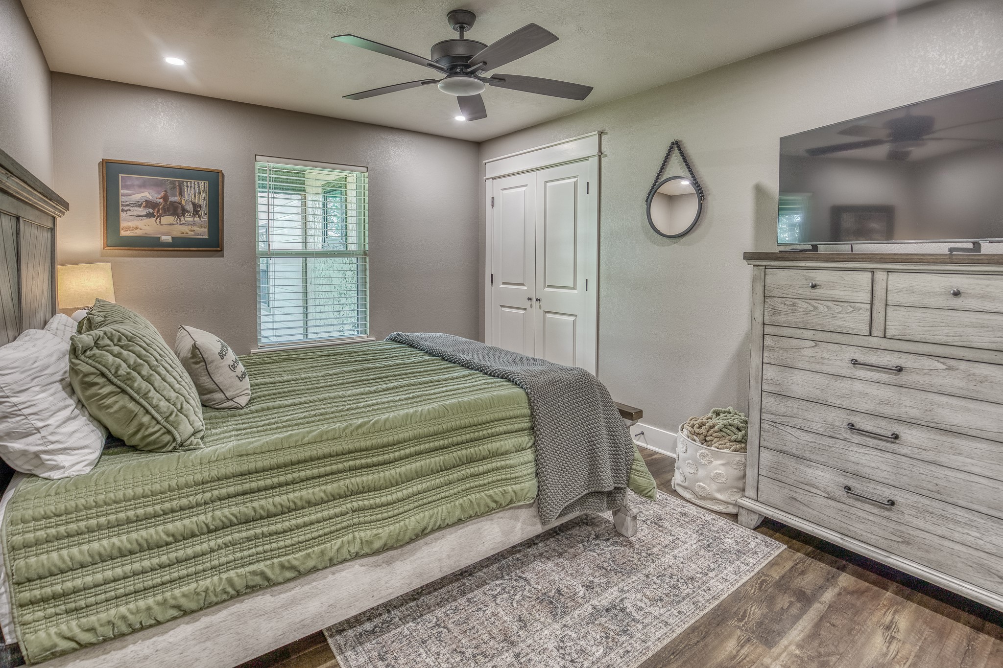 5344 Andert Road Bryan, TX 77808 - Photo 18 of 50 a bedroom with a bed and a flat screen tv