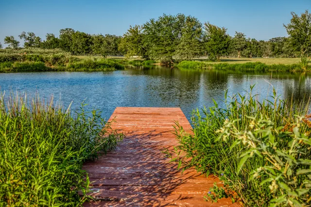 a view of a lake with a house in the background