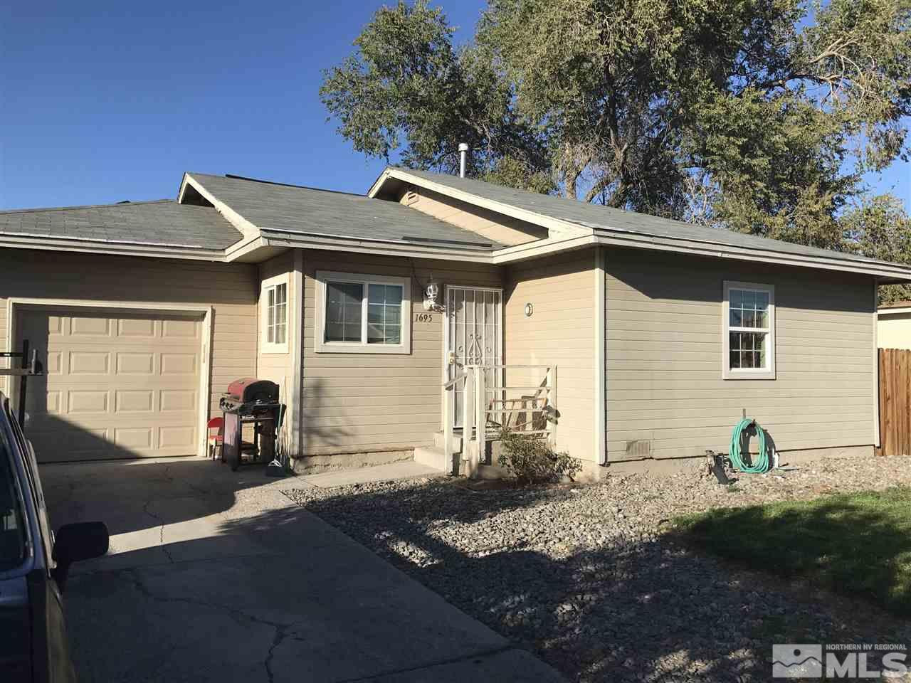 1695 Castle Way Reno, NV 89512 - Photo 1 of 1 a front view of a house with garden
