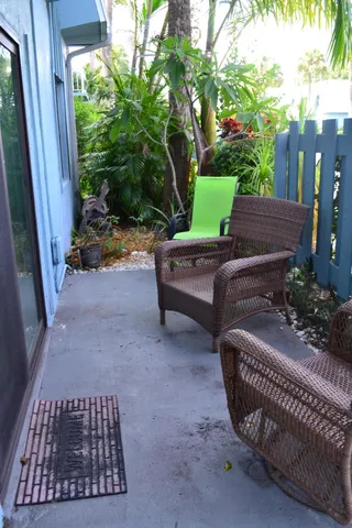 a view of a backyard with sitting area