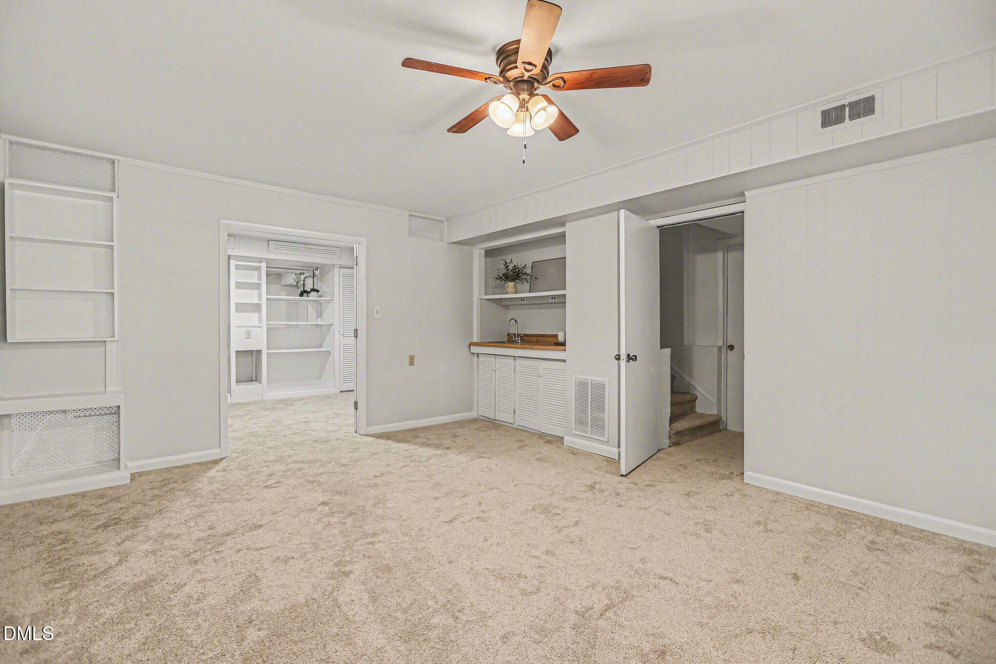 2600 Wade Avenue Raleigh, NC 27607 - Photo 15 of 31 an empty room with closet and a ceiling fan
