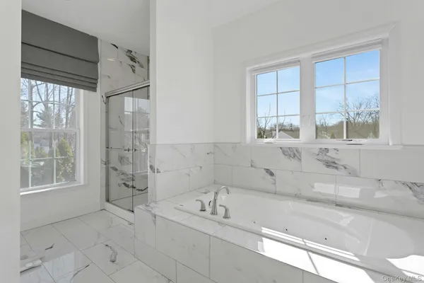 a bathroom with a bathtub and a sink