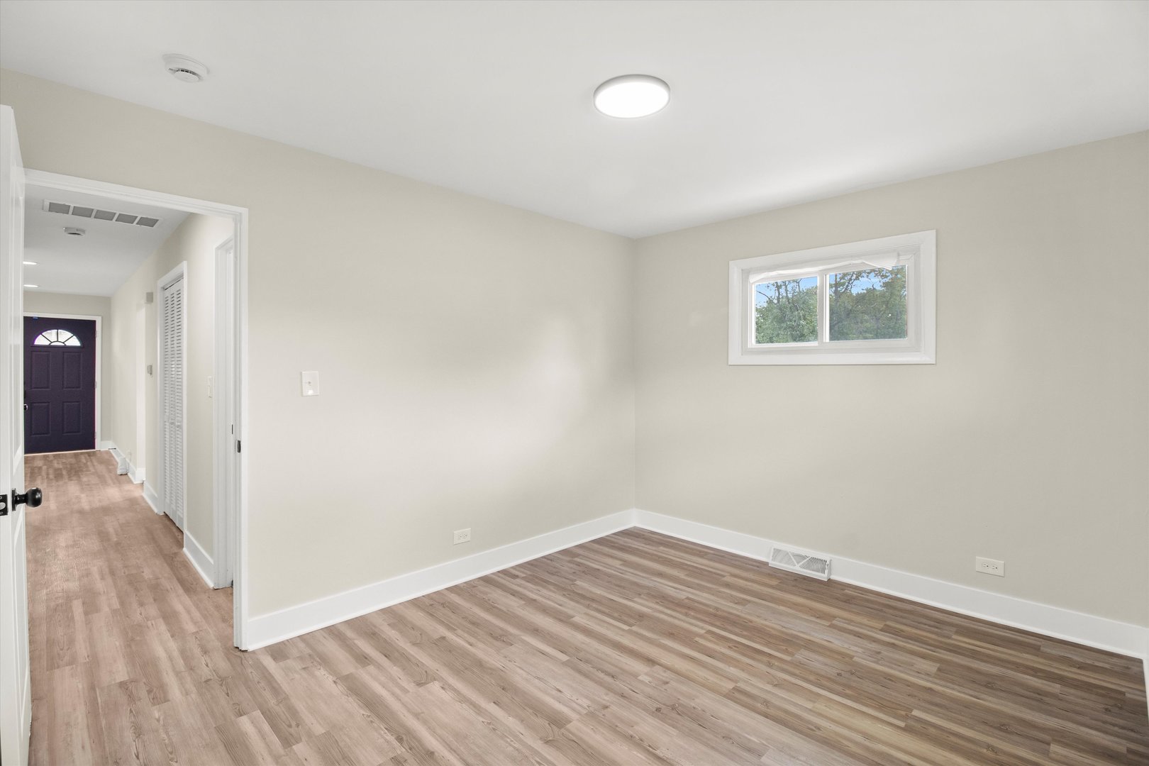 16460 Honore Avenue Markham, IL 60428 - Photo 13 of 38 a view of a room with wooden floor and a window
