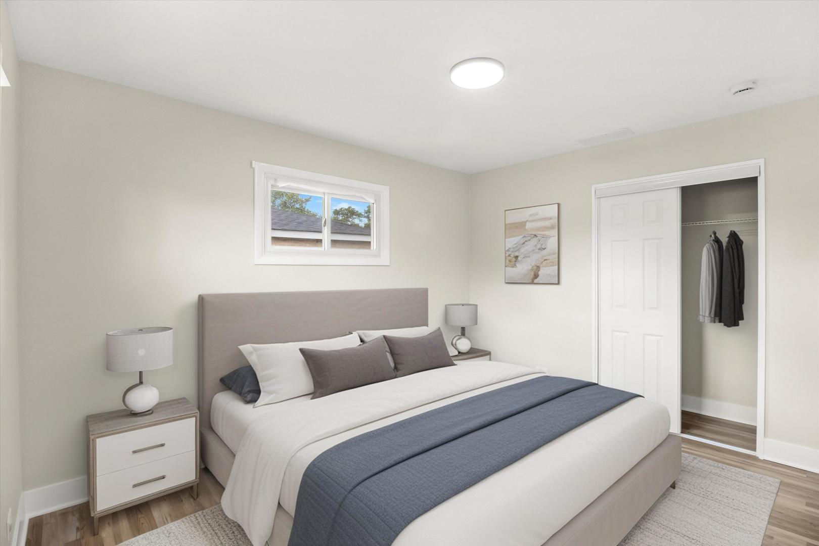 16460 Honore Avenue Markham, IL 60428 - Photo 16 of 38 a bedroom with a bed and a lamp on dresser