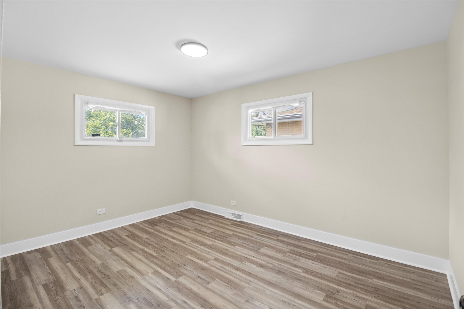 16460 Honore Avenue Markham, IL 60428 - Photo 19 of 38 a view of room with window and hardwood floor