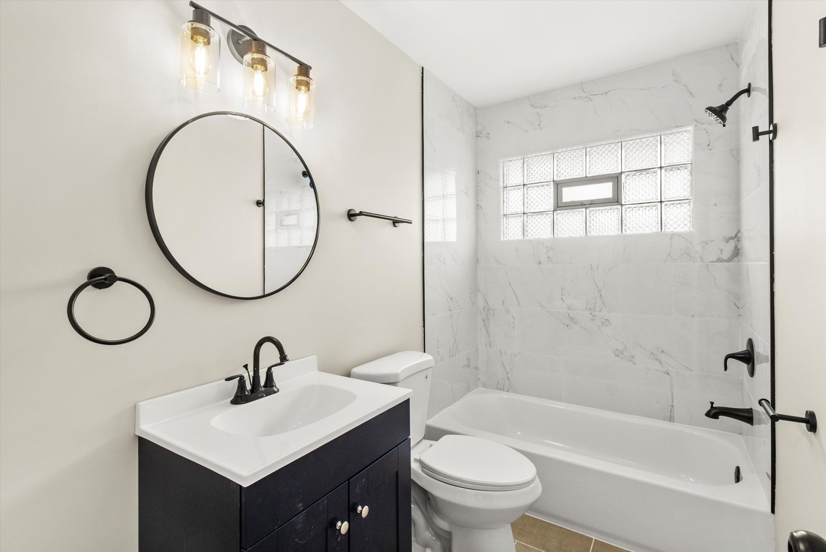 16460 Honore Avenue Markham, IL 60428 - Photo 31 of 38 a bathroom with a sink a toilet and a mirror