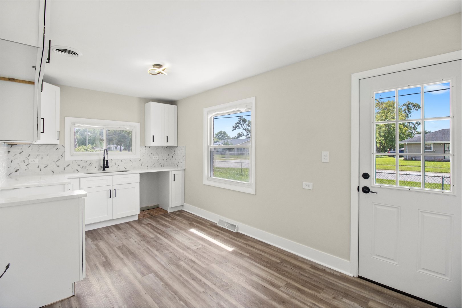 16460 Honore Avenue Markham, IL 60428 - Photo 7 of 38 a view of a kitchen counter space with wooden floor
