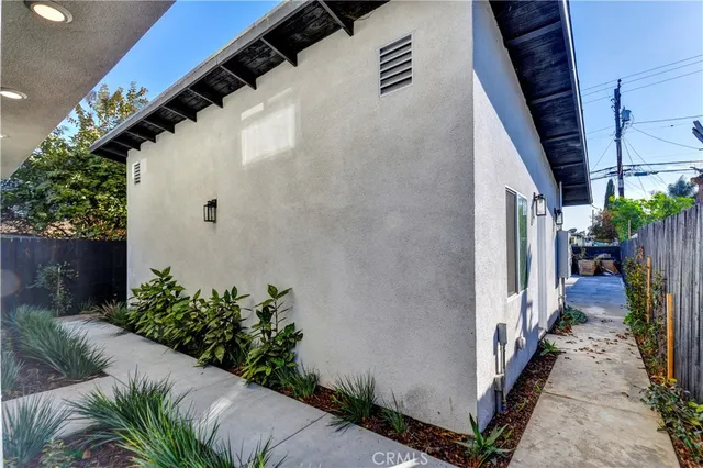 a view of a house with backyard porch and sitting area