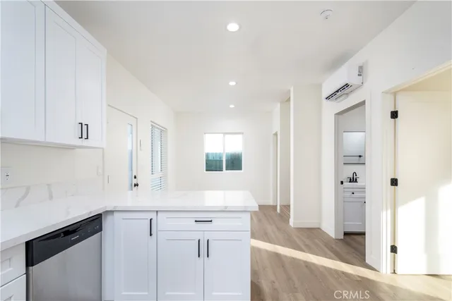 a kitchen with a sink cabinets and a refrigerator