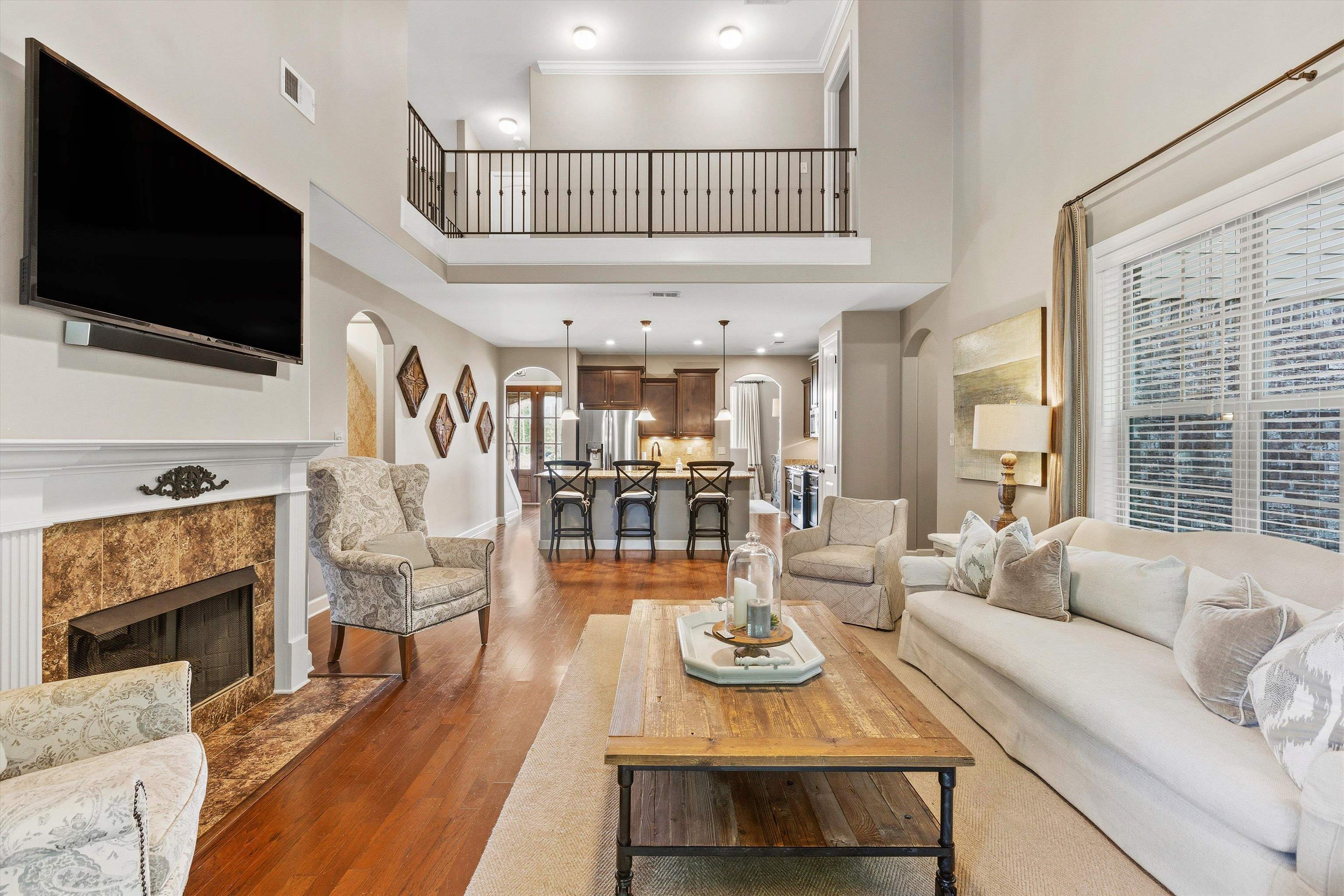 141 Lower Fields Lane Collierville, TN 38017 - Photo 29 of 29 Den has great natural lighting from windows. Open floorplan.