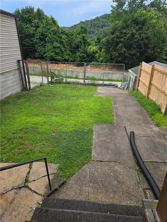a backyard of a house with lots of green space