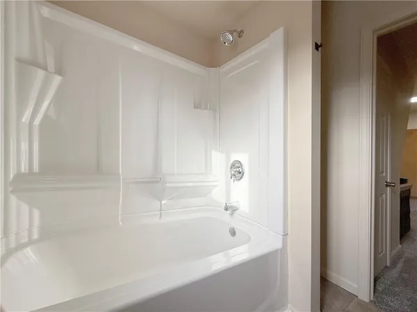 a close view of a bathtub in bathroom