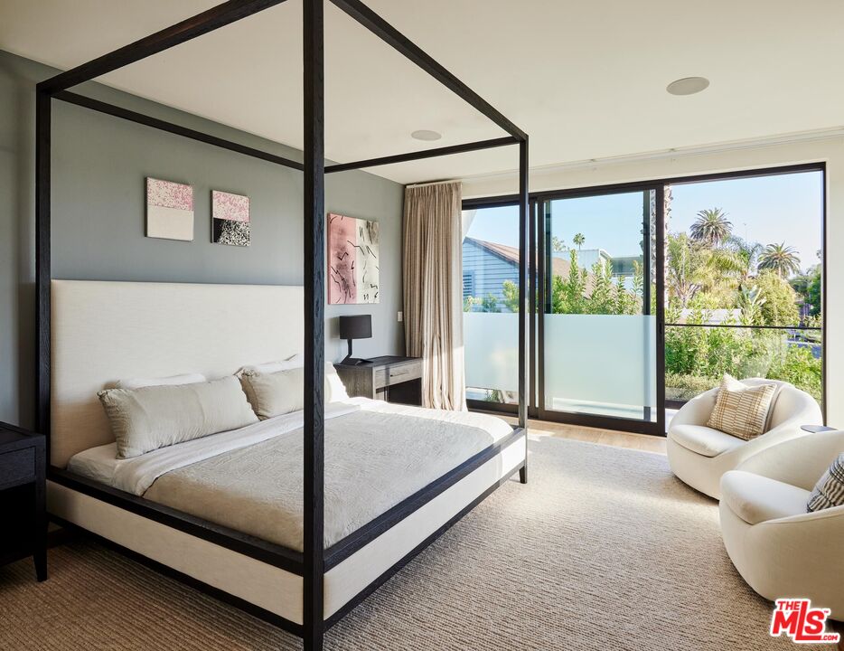330 Rennie Avenue, Unit 1 Venice, CA 90291 - Photo 13 of 34 a bedroom with a bed and glass walk in closet