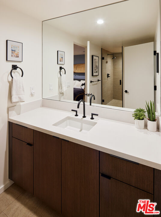 330 Rennie Avenue, Unit 1 Venice, CA 90291 - Photo 26 of 34 a bathroom with a sink and a mirror
