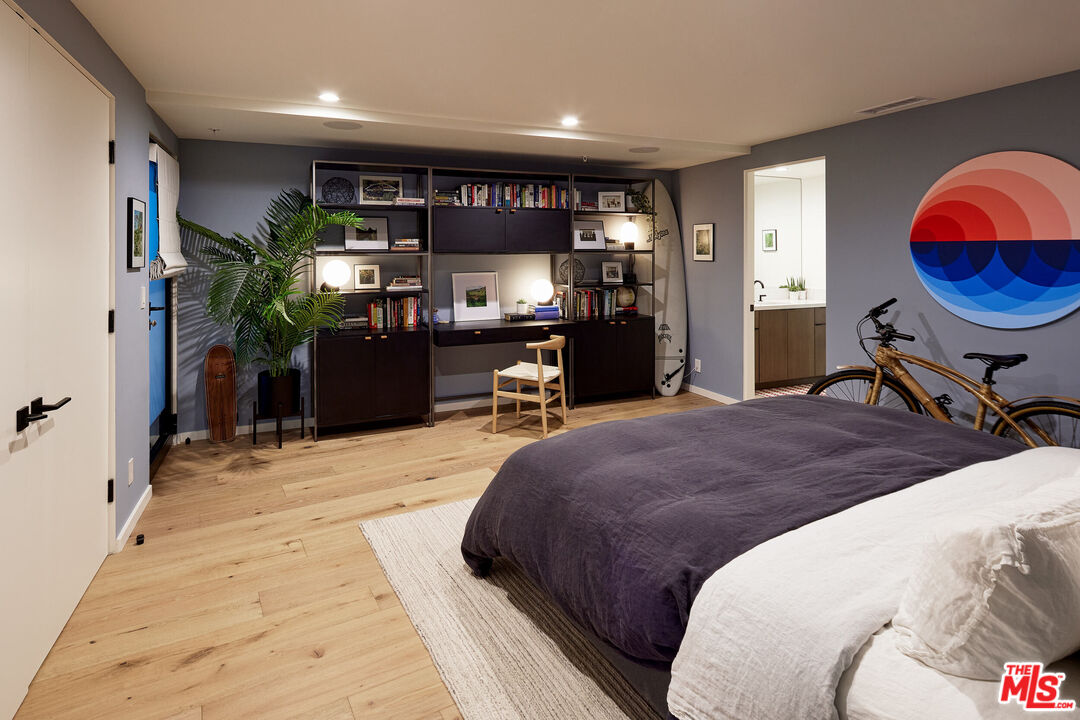 330 Rennie Avenue, Unit 1 Venice, CA 90291 - Photo 28 of 34 a bedroom with a bed and dresser with mirror