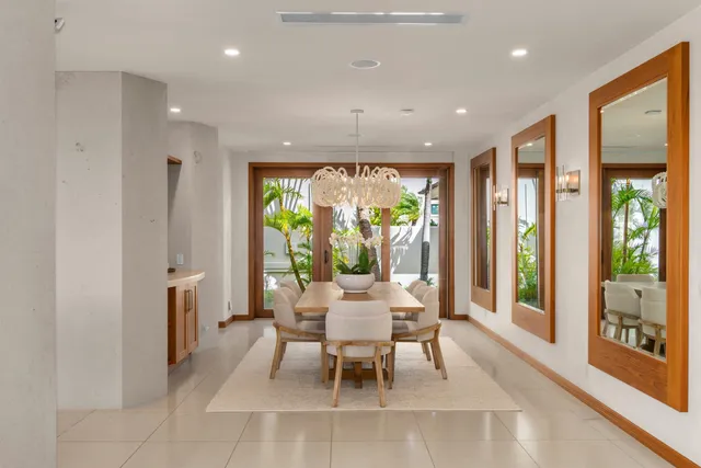 a living room with furniture and a kitchen view