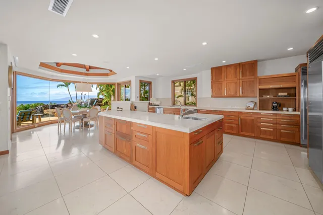 a kitchen with stainless steel appliances granite countertop a sink and cabinets