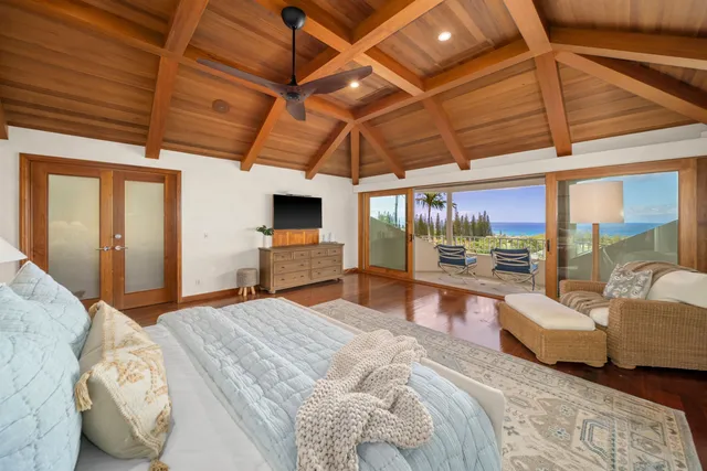a view of a living room and floor to ceiling window or wooden floor