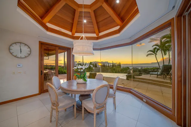 a view of a patio with a table chairs and a potted plant