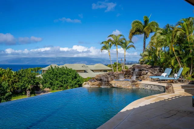 a view of a lake with a house in background